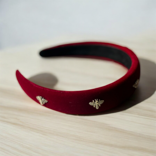 Golden Buzz: Bee-Band Headband with Striking Red and Gold Accents